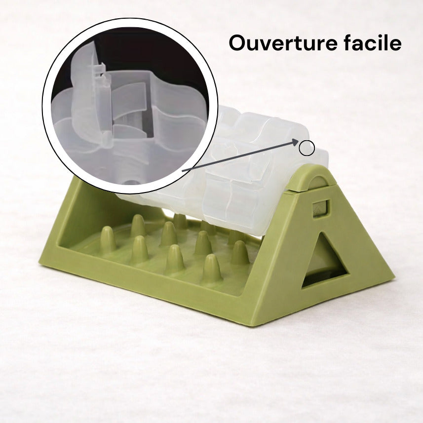 Détail du mécanisme d'ouverture du distributeur de croquettes su socle Canidoo